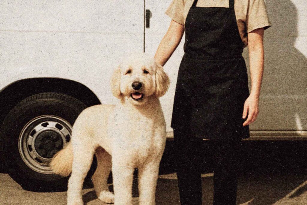 Hydrodog franchise groomer and dog outside mobile grooming van